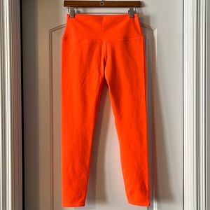 NWOT alo yoga neon orange leggings. Medium